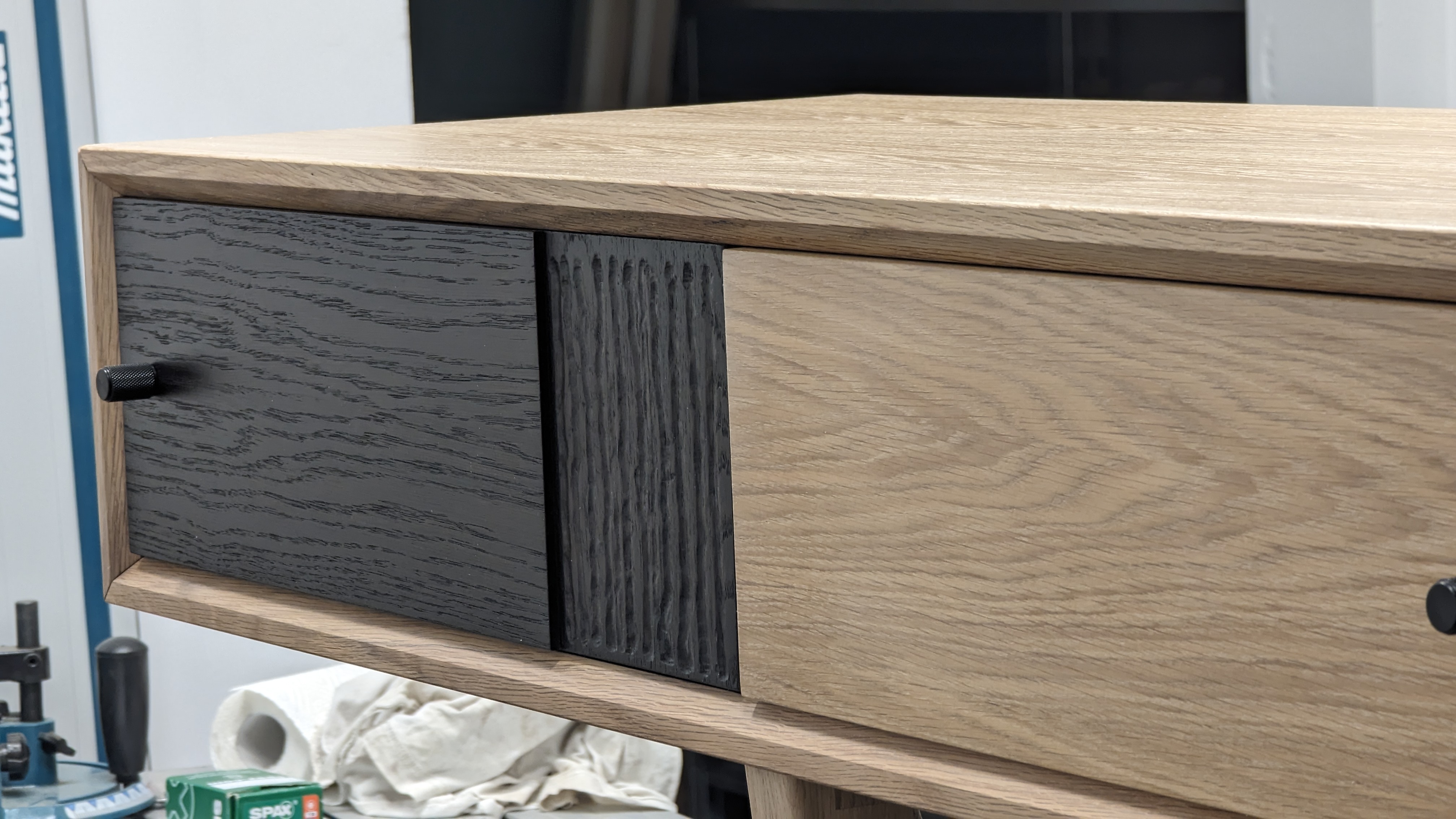 Oak media console with ebonised drawer fronts